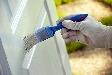 Image showing Painting wooden door