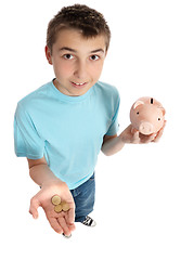 Image showing Boy holding coins for money box