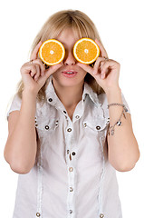 Image showing Funny girl with oranges. Isolated on white