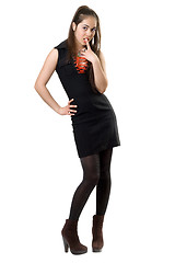 Image showing Playful pretty girl in black dress. Isolated