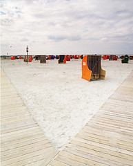 Image showing roofed wicker beach chairs