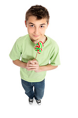 Image showing Boy holding a lollipop