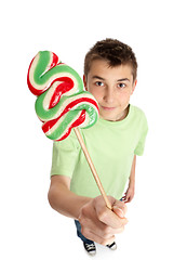 Image showing Boy showing lollipop candy