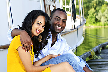 Image showing Happy couple in front of yacht