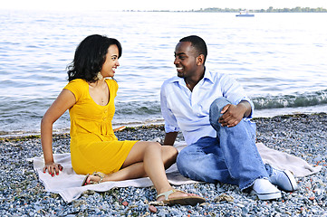 Image showing Happy couple sitting at beach