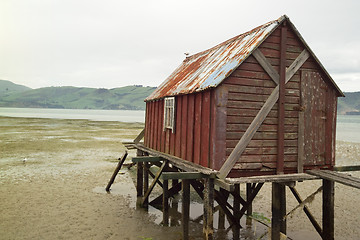 Image showing boathouse in tide