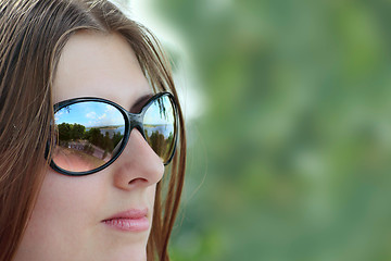 Image showing The cute girl in sun glasses