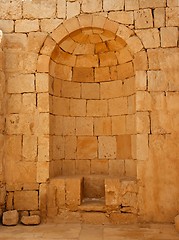 Image showing Ancient stone wall with arched niche