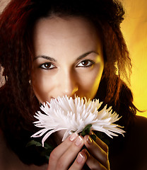 Image showing Girl with a white flower