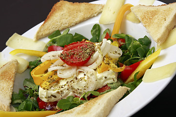 Image showing baked feta cheese on lambs lettuce