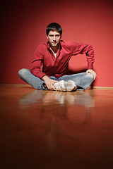 Image showing sexy young man on red background