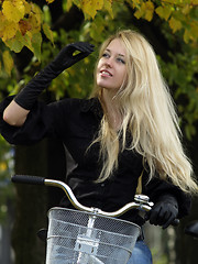 Image showing Young woman on bicylce