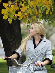 Image showing Young woman on bicylce