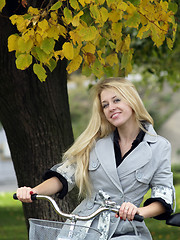 Image showing Young woman on bicylce