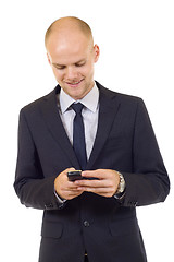 Image showing Young happy man holding mobile phone