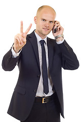 Image showing businessman on the phone making his victory sign