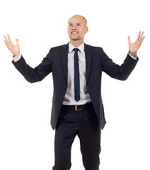 Image showing energetic businessman with his arms raised