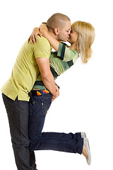 Image showing young man kissing his girlfriend in the air