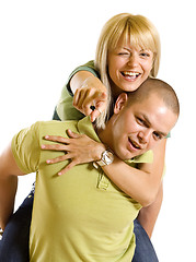 Image showing Young man carrying his cute girl on back