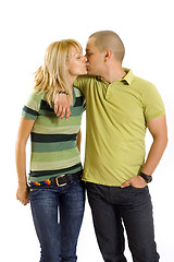 Image showing young couple kissing, studio shot