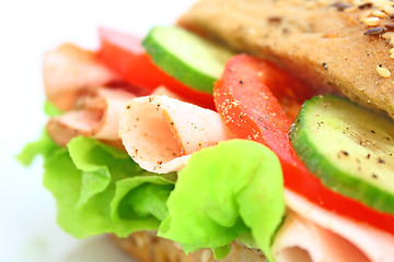 Image showing Fresh sandwich with ham and cheese and vegetables