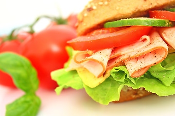 Image showing Fresh sandwich with ham and cheese and vegetables