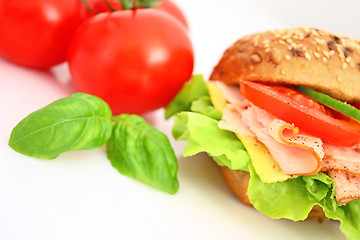 Image showing Fresh sandwich with ham and cheese and vegetables