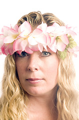 Image showing pretty middle age woman wearing hawaiian floral lei in her hair
