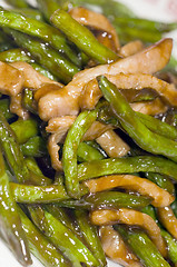 Image showing chinese food chicken strips with string beans