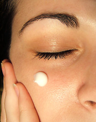 Image showing Cream on a girl face