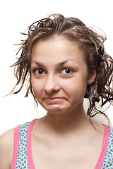 Image showing Young girl with wet hair, make faces