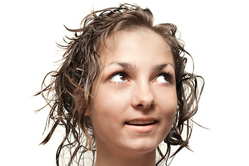 Image showing Beautiful girl with wet hair looks upwards