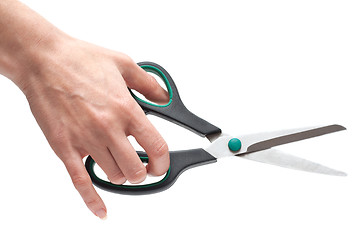 Image showing Feminine hand with scissors