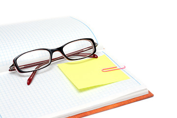 Image showing Spectacles on note pad