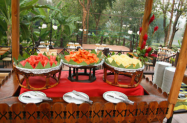 Image showing Wooden table, papaya, watermelon, pineapple