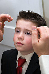 Image showing Father Helping Son Get Ready