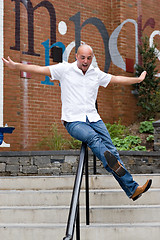 Image showing Sliding Down a Railing