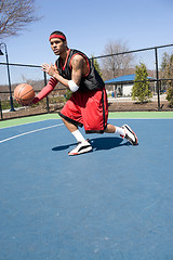 Image showing Basketball Player Dribbling