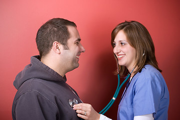 Image showing Checking His Heartbeat