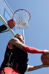 Image showing Basketball Player Dunking