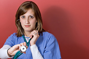 Image showing Nurse Using a Stethoscope