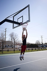 Image showing Man Dunking a Basketball