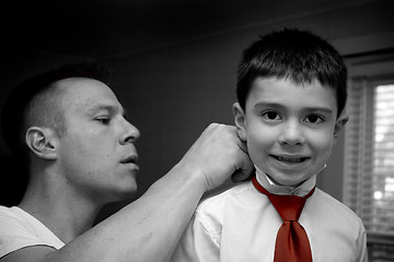 Image showing Father Helping Son Get Ready