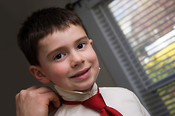 Image showing Father Helping Son Get Ready