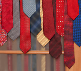 Image showing Male ties hung on door