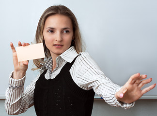 Image showing Beautiful girl shows orange card