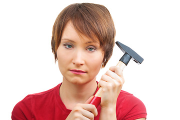 Image showing Sad woman with  hammer
