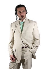 Image showing Businessman closing a deal on the headset phone