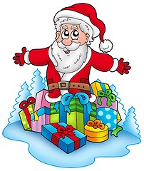 Image showing Happy Santa Claus with pile of gifts