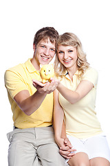 Image showing Young couple saving money